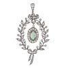 An early 20th century silver paste pendant. The oval-shape green and colourless paste cluster, suspe