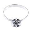 ALTON - a 1970s bangle set with rock crystal. Designed as a central stylised flower collet-set with