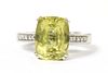 A gold heliodor and diamond ring,