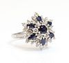 A white gold sapphire and diamond snowflake cluster ring,