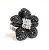 A Continental white and black diamond orchid ring, c.1990,