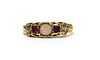 A gold opal, ruby and diamond ring,