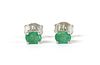 A pair of white gold single stone emerald stud earrings,