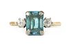 A gold blue zircon and diamond three stone ring,