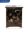 A MEIJI PERIOD JAPANESE EBONISED LACQUER CABINET 
