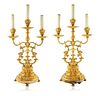 A PAIR OF BRONZE THREE-LIGHT ELECTRIFIED CANDELABRAS