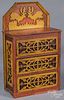 Painted doll-size fretwork chest of drawers