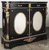 French ebonized side cabinet, 19th c., with gilt bronze mounts, a black marble top