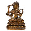 A GILT BRONZE FOUR-ARMED SEATED BODHISATTVA