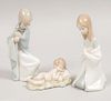 Virgen María, san José y Niño Jesús en pesebre. España, SXX. Elaboradas en porcelana Lladró. Acabado brillante. 15 cm de altura.