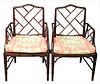 Pair of Faux Bamboo Chinese Chippendale Bamboo Arm Chairs, with caned seats and custom cushions, height 36 inches, width 23 inches.