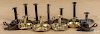 Group of eleven brass and tin candlesticks