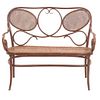 Love seat SXX. Estilo Austriaco. Elaborado en madera Respaldo semiabierto, asiento de bejuco tejido, chambrana oval y soportes lisos.