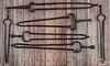 Six pairs of wrought iron fireplace tongs