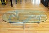 OVAL GLASS-TOP COFFEE TABLE ON CHROME STAND