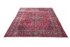 A LARGE PERSIAN MASHAD CARPET, the red ground with traditio