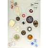 A CARD OF ASSORTED MATERIAL OBJECT BUTTONS INCL. CLOCKS