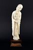 Late 19th/early 20th century Chinese carved ivory figure of a bald man holding a small pot in his le
