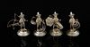 Set of four Chinese Sterling silver figures of orientals at various pastimes, one with net another c