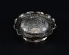 Chinese silver dish of shaped circular form engraved with figures at various pastimes, the cover wit