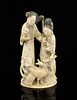 19th century Chinese carved ivory figural group of two ladies, one standing the other seated, holdin