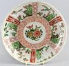 Chinese famille verte dish with panels of floral decoration, blue mark to base, 27cm diameter,