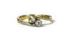 An 18ct gold two stone diamond crossover ring,