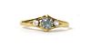 An 18ct gold three stone aquamarine and diamond ring,