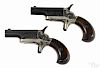 Pair of Colt derringer pistols, .22 short caliber, with nickel frames