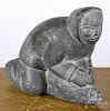 Inuit carved soapstone, 20th c., of an Eskimo and seal, 5 3/4'' h.