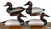 Four Chesapeake Bay carved and painted duck decoys, mid 20th c., to include canvasbacks
