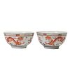 A PAIR OF FAMILLE-ROSE 'DRAGONS' BOWLS