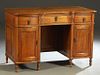 English Carved Oak Desk, early 20th c., the serpentine top over a center frieze drawer, flanked by pedestals with bowed frieze drawers over bowed cupb
