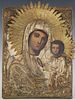 Russian Icon of Madonna and Child, 19th c., with a brass repousse oklad, on a curved wood panel, H.- 9 1/4 in., W.- 6 3/4 in.