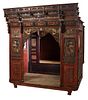 Chinese Carved Mixed Woods Canopy Bed, 19th c., with alcove, Zhejiang province, with a stepped intricately carved pierced crown over pierced highly ca