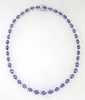 14K White Gold Link Necklace, each of the forty-one oval links with a graduated oval tanzanite atop a border of tiny round white diamonds, total tanza