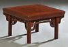 Chinese Carved Elm Kang Table or Low Stool, c. 1900, the thick top on cylindrical legs joined by arched stretchers, H,- 12 in. W.- 19 1/4 in., D.- 19 