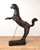 A South-East Asian carved and polychrome painted wooden horse,