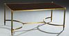Maison Jansen Style Mid Century Modern Brass Plated Iron and Mahogany Coffee Table, 20th c., the rectangular top within a brass plated frame, on reede