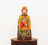 A Chinese polychrome painted wooden house god or attendant,