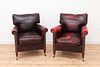 A pair of club armchairs,