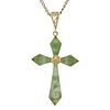 A nephrite jade cross pendant. The nephrite jade cross, to the openwork surmount, suspended from a c