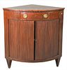 Continental Mahogany Corner Cabinet, having one drawer over two faux tambour doors, opening to interior shelving, height 36 1/2 inches, top 25" x 35".