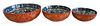 Three Japanese Porcelain Stacking Bowls, having blue and white interior with orange and gold exterior, each on wood stands, largest 2 3/4 inches, diam