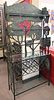 Iron Bakers Rack, having five shelves and a wine rack and tree forms mounted to the exterior, height 80 1/2 inches, width 37 3/4 inches, depth 15 inch