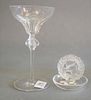 Two Piece Lalique Lot, to include a "Bacchus" martini glass, along with ring dish having a dove in a wreath, both marked to the underside, martini hei