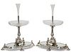 A HANDSOME PAIR OF 19TH CENTURY SILVER-PLATED CENTREPIECES ON MIRRORED STAN