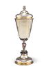 AN 18TH CENTURY RUSSIAN PARCEL-GILT SILVER CUP AND COVER, the domed lift-of