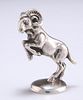 A CONTINENTAL 800 GRADE SILVER MODEL OF A GOAT, cast rearing, stamped 800. 