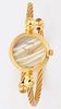 A LADY'S GOLD-PLATED GUCCI BANGLE WATCH,?circular mother-of-pearl dial with